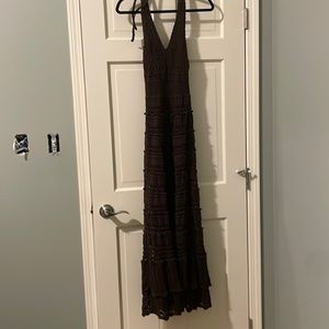 A long brown crochet style dress with an underneath coverage to your butt